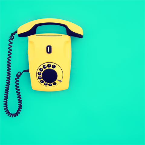 Image of a yellow wall phone